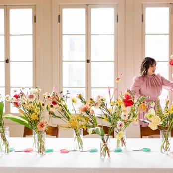 Inessa Nichols Design - Inessa setting up the bouquet making table at our latest event for International Women's Day. - Floral Designers Near Me Inessa Nichols Design - Inessa setting up the bouquet making table at our latest event for International Women's Day. - Floral Designers Near Me