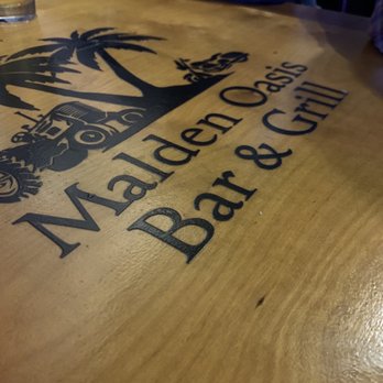 Malden Oasis Bar & Grill - the logo on the table - Pubs Near Me - Valparaiso, Indiana