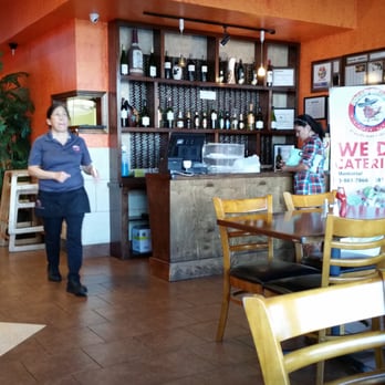 Pollo Bravo - a woman standing in a restaurant - Mexican Near Me - Katy, Texas Pollo Bravo - a woman standing in a restaurant - Mexican Near Me - Katy, Texas