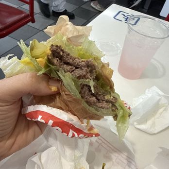 In-N-Out Burger - Half eaten lettuce, wrapped burger with no salt on the patty, pickles and it was perfectly delicious - Burgers Near Me - Torrance, California