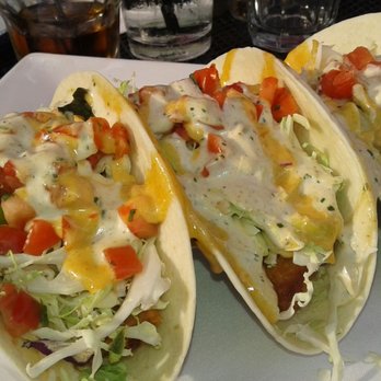 Captains Quarters Riverside Grille - Grilled or Fried Fish Tacos Three soft tortillas with shredded cabbage, red onion, pico de gallo, spicy remoulade and cilantro creme - Seafood Near Me - Prospect, Kentucky Captains Quarters Riverside Grille - Grilled or Fried Fish Tacos Three soft tortillas with shredded cabbage, red onion, pico de gallo, spicy remoulade and cilantro creme - Seafood Near Me - Prospect, Kentucky