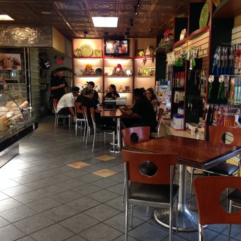 Venda Ravioli - Plenty of seating.  Notice the cooking utensils on the right. - Italian Near Me - Providence, Rhode Island