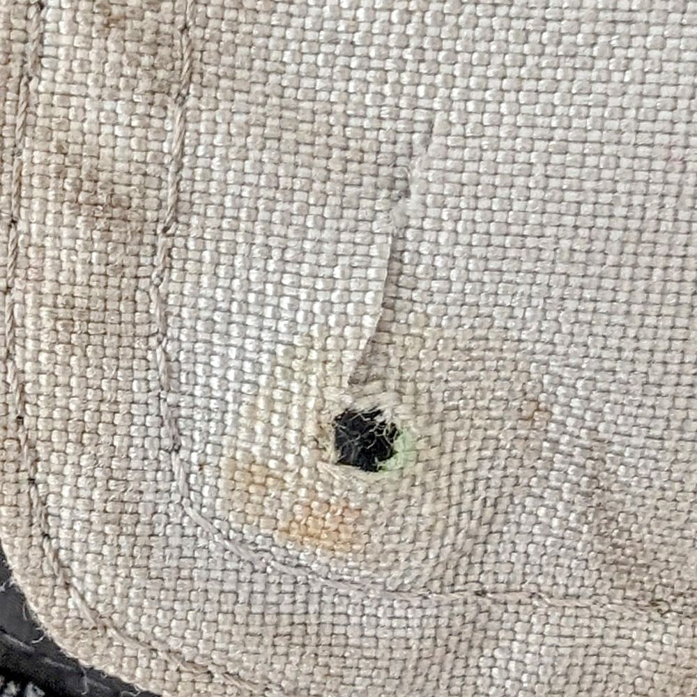 This was the "repair" they did on my pants.  Removed the snap on my motorcycle pants and cut a hole to allow a button to pass through.  Yes,