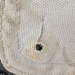 This was the "repair" they did on my pants.  Removed the snap on my motorcycle pants and cut a hole to allow a button to pass through.  Yes,