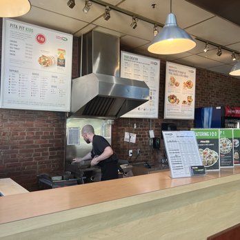 Pita Pit - a man preparing food in a restaurant - Sandwiches Near Me - Vancouver, British Columbia Pita Pit - a man preparing food in a restaurant - Sandwiches Near Me - Vancouver, British Columbia