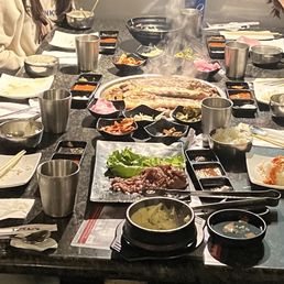 Beef bulgogi, pork belly, banchan, steamed egg, rice