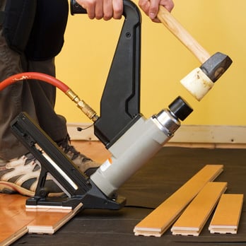 Wood Floor Refinishing - a man using a nailer - Flooring Near Me - East Rutherford, New Jersey Wood Floor Refinishing - a man using a nailer - Flooring Near Me - East Rutherford, New Jersey