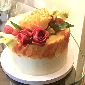 Aromas Boutique Bakery - Side view -- Custom, lemon raspberry 6 inch cake. - Desserts Near Me Aromas Boutique Bakery - Side view -- Custom, lemon raspberry 6 inch cake. - Desserts Near Me