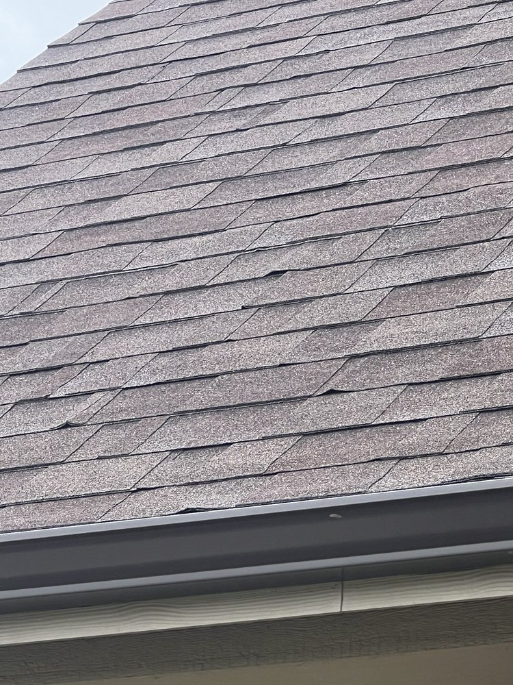 Slide of Tucker Roofing Systems