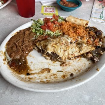 Chuy's - Steak burrito with the onions scraped off to one side - Mexican Near Me - Houston, Texas