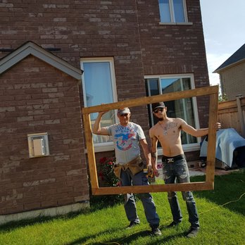 DJB Fencing Plus+ - two men holding a picture frame - Fences & Gates Near Me DJB Fencing Plus+ - two men holding a picture frame - Fences & Gates Near Me