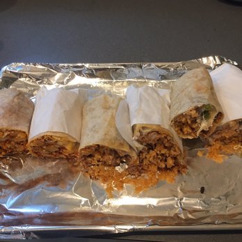Ricos Burritos - four burritos wrapped in aluminum foil - Mexican Near Me - Portland, Oregon