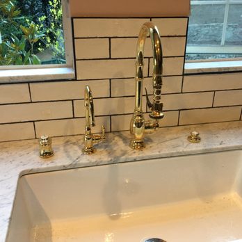 Ervin's Plumbing - Finishing a kitchen remodel with beautiful brass facucet, air gap and garbage disposal button - Plumbing Near Me Ervin's Plumbing - Finishing a kitchen remodel with beautiful brass facucet, air gap and garbage disposal button - Plumbing Near Me