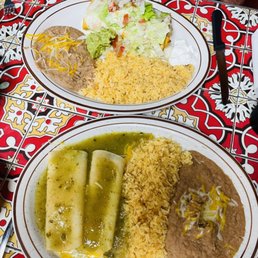 Chimichanga (top) and cheese enchiladas with tomatillo sauce Chimichanga (top) and cheese enchiladas with tomatillo sauce