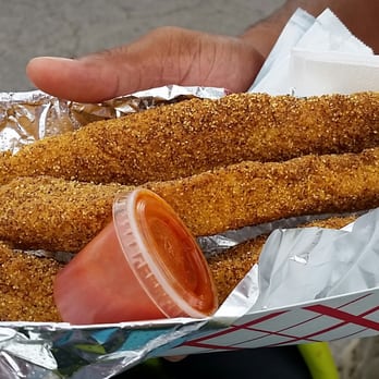 Chick N Wangs - a person holding a basket of chicken nuggies - Food Trucks Near Me Chick N Wangs - a person holding a basket of chicken nuggies - Food Trucks Near Me