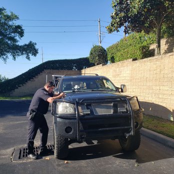 Hampton Inn & Suites Clermont - Police officer writing report. - Hotels Near Me - Clermont, Florida