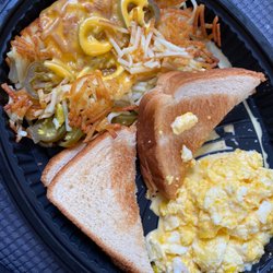 Waffle House - 2 egg breakfast with toast and hash browns smothered/covered/peppered. Yum!