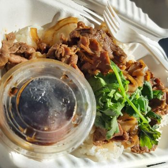 Saigon Cafe - a styrofoam takeout container with a meat dish and a drink - Vietnamese Near Me - Cotati, California
