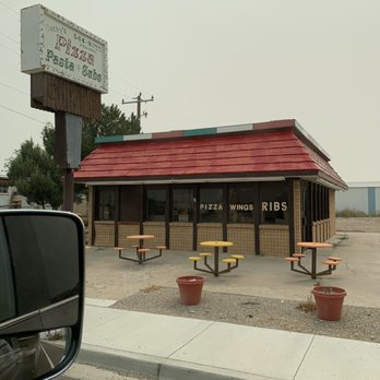 Green River City Shop - a red roof and picnic tables - Convenience Stores Near Me - Green River, Utah