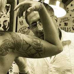 Black Anchor Tattoo - Ken Motter, placing a stencil.