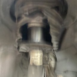 Struts under my car blown bag car on the ground tires ready to blow