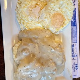 Eggs over easy with biscuits and gravy