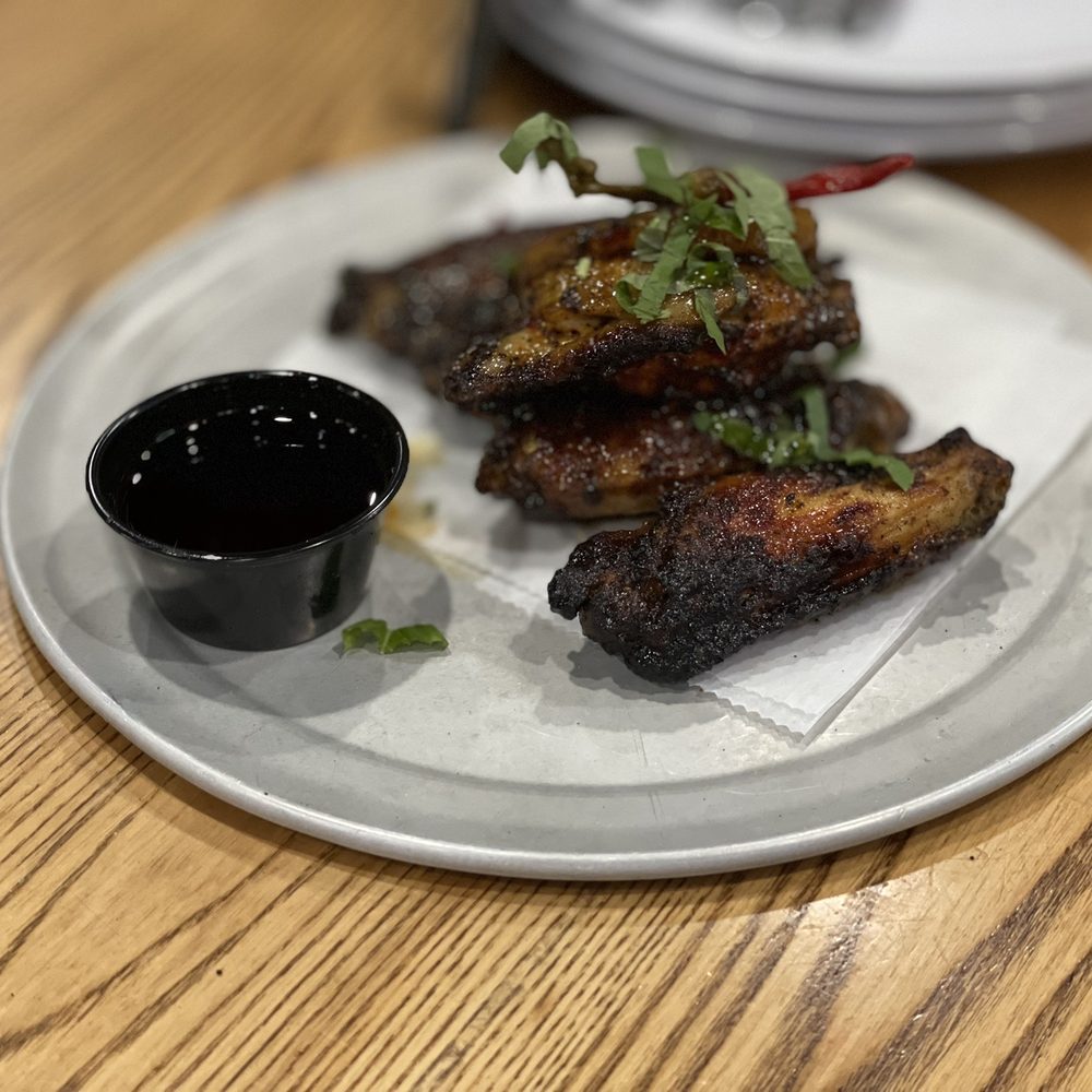 V Pizza - a plate of food on a wooden table - Pizza Near Me - Cary, North Carolina V Pizza - a plate of food on a wooden table - Pizza Near Me - Cary, North Carolina