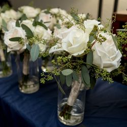 Camille's Floral & Boutique - Bridal party bouquets from photographer
