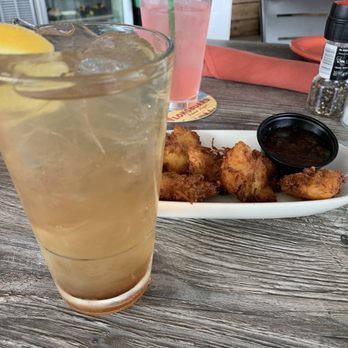 Salt Cracker Fish Camp - That's my ice tea after it was driven through Long Island, along with our conch fritters... yass and the sauce on the side great!!! - Seafood Near Me - Clearwater, Florida Salt Cracker Fish Camp - That's my ice tea after it was driven through Long Island, along with our conch fritters... yass and the sauce on the side great!!! - Seafood Near Me - Clearwater, Florida