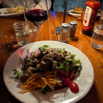 Hudson’s Mill - The steak salad and my glass of pinot noir :) - New American Near Me - Garnerville, New York