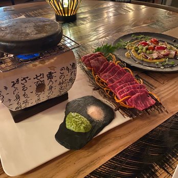 Iza Whiskey & Eats - Ishiyaki BBQ with Wagyu Beef (Wagyu available on limited occasions). Uni Butter Octopus. - Sushi Bars Near Me - Carrboro, North Carolina