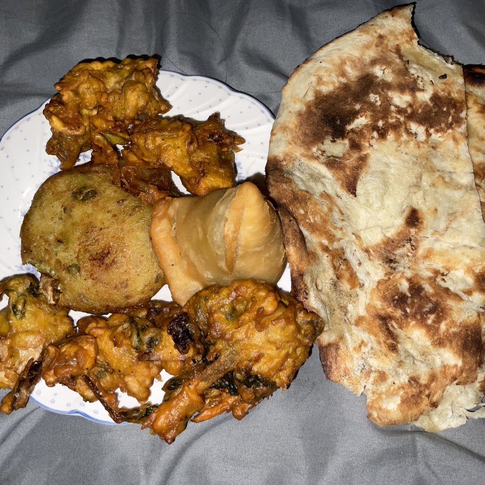 Prince of India - Appetizer platter on the right: aloo tikki, pakoras, and a samosa. Left: naan bread. - Indian Near Me - Pittsburgh, Pennsylvania