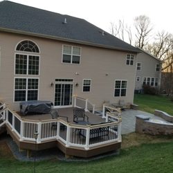 Quality Carpentry Works - Azek Deck Boards, Vinyl Railings with Black Balusters Plus Lighted post Caps and the Drink Rail Option. In Addition too a Small Patio.