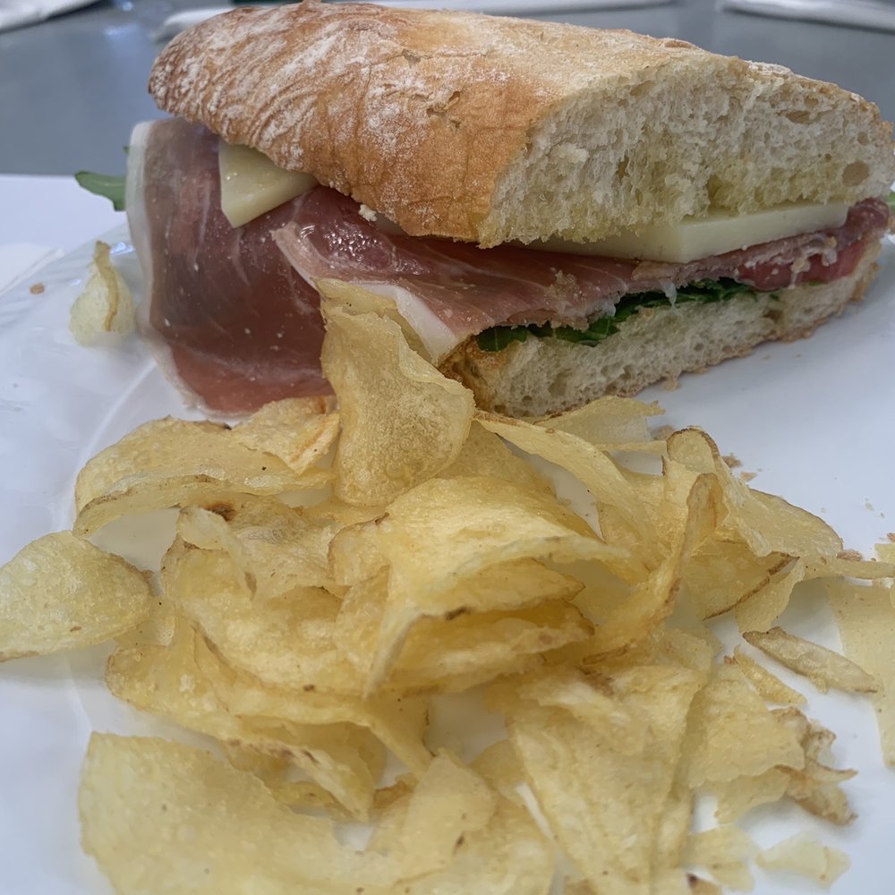 La Despensa - a sandwich and chips on a plate - Spanish Near Me - Key Biscayne, Florida La Despensa - a sandwich and chips on a plate - Spanish Near Me - Key Biscayne, Florida