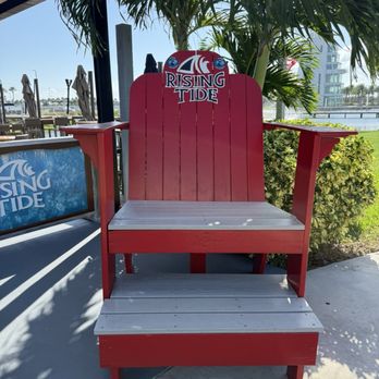 Rising Tide Tap And Table - Chair at entrance to bar and restaurant. - American Near Me - Cape Canaveral, Florida Rising Tide Tap And Table - Chair at entrance to bar and restaurant. - American Near Me - Cape Canaveral, Florida