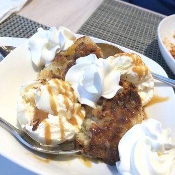 NM Cafe - Peach cobbler with ice cream served warm - New American Near Me - Garden City, New York