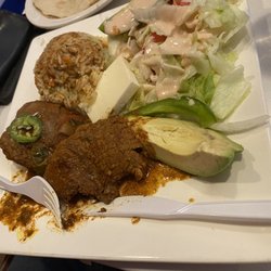 Catrachos Restaurant - Carne Guisada-beef stew meat with avocado, rice, and salad