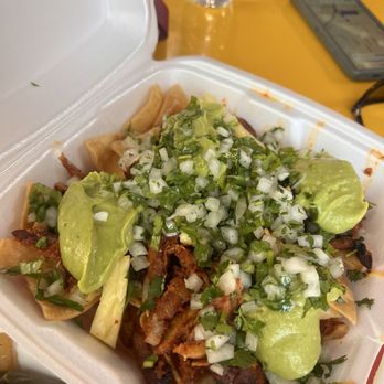 Tacos Calafia - Downtown - Nachos Al Pastor with extra toppings from the self serve Salsa bar - Tacos Near Me - Phoenix, Arizona Tacos Calafia - Downtown - Nachos Al Pastor with extra toppings from the self serve Salsa bar - Tacos Near Me - Phoenix, Arizona