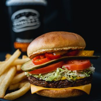 Harvey's - a burger and fries on a plate - Burgers Near Me - Vimont, Quebec