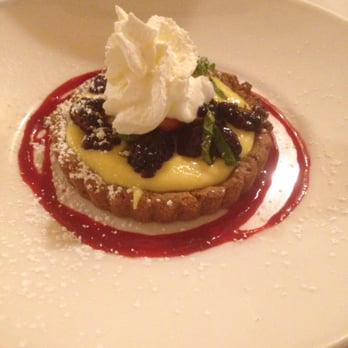 Chef Warren's - Key lime curd on a warm tart with berry coulis & fresh local strawberries. - New American Near Me - Southern Pines, North Carolina Chef Warren's - Key lime curd on a warm tart with berry coulis & fresh local strawberries. - New American Near Me - Southern Pines, North Carolina