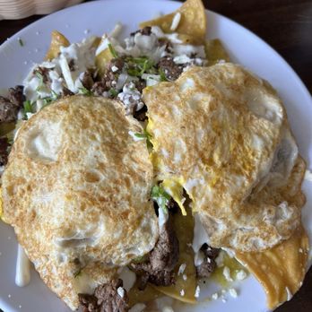 Ancestros - Green Chilaquiles with overhard eggs and steak - Mexican Near Me - Long Beach, California