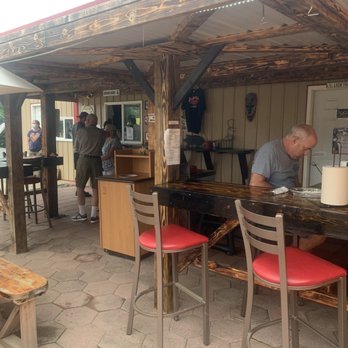 Lost Mountain BBQ company - a man sitting at a bar - Barbeque Near Me - Romney, West Virginia Lost Mountain BBQ company - a man sitting at a bar - Barbeque Near Me - Romney, West Virginia