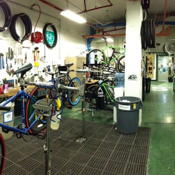MSU Bikes - Panoramic of workshop area. Two of our three double-workstands are visible in this photo. - Bike Rentals Near Me - East Lansing, Michigan MSU Bikes - Panoramic of workshop area. Two of our three double-workstands are visible in this photo. - Bike Rentals Near Me - East Lansing, Michigan