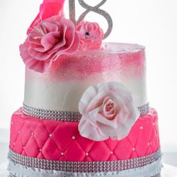 Southerland Desserts - 18th Birthday cake made of butter cake & Italian Meringue buttercream decorated with gumpaste flowers and bling.