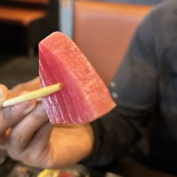 This is a piece of tuna sashimi This is a piece of tuna sashimi