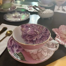Pink floral tea cups, the table setting as we walked in. Pink floral tea cups, the table setting as we walked in.