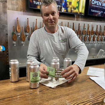 The Cascade Draft House - My peanut butter chocolate milk stout being labeled - Bars Near Me - Bristol, Tennessee