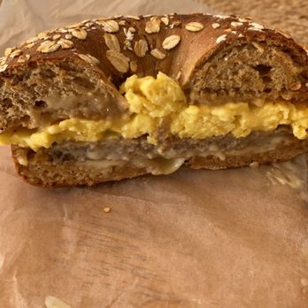 Muffin House Cafe - Sausage, egg, and American cheese on a honey wheat bagel - Coffee & Tea Near Me - Hopkinton, Massachusetts
