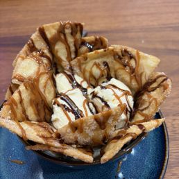 Nachos with cinnamon and sugar with vanilla icecream drizzled with chocolate and caramel sauce