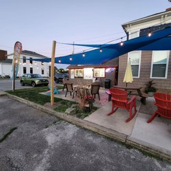 Westcott's Arctic Shaved Ice - Seating area with shade sail and ambient lighting.